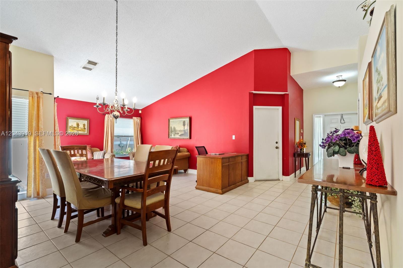 A dining area and office space feature red walls, vaulted ceilings, and tile flooring — 4931 SW 152nd Ave, Miramar FL 33027, MIRAMAR, FL