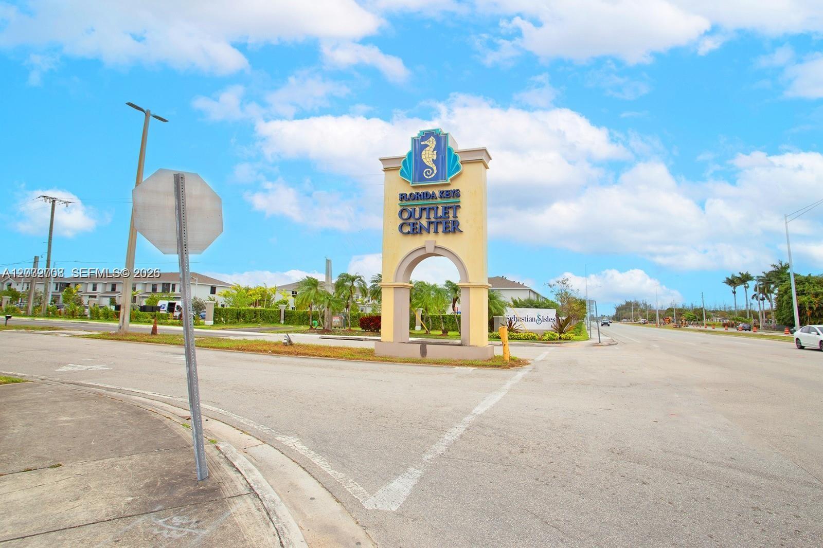 A large sign for the Florida Keys Outlet Center stands at a street intersection — 109 NE 3rd Ct, Florida City FL 33034, FLORIDA CITY, FL