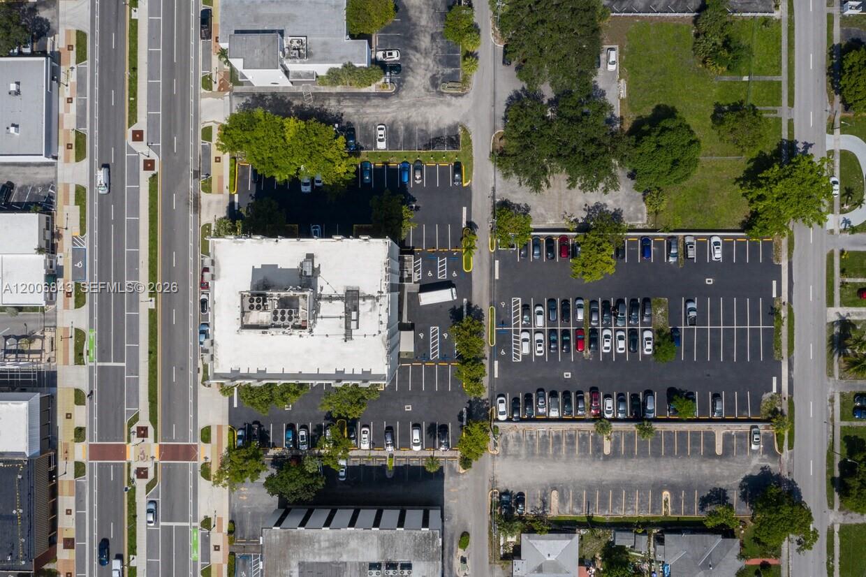 This aerial view shows a commercial building surrounded by parking lots and adjacent streets — 2450 Hollywood Blvd, Hollywood FL 33020, HOLLYWOOD, FL