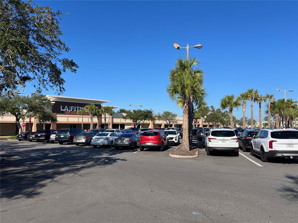 A parking lot in front of a shopping center with an LA Fitness gym — 1074 MONTGOMERY ROAD UNIT 1042-1046, ALTAMONTE SPRINGS, FL