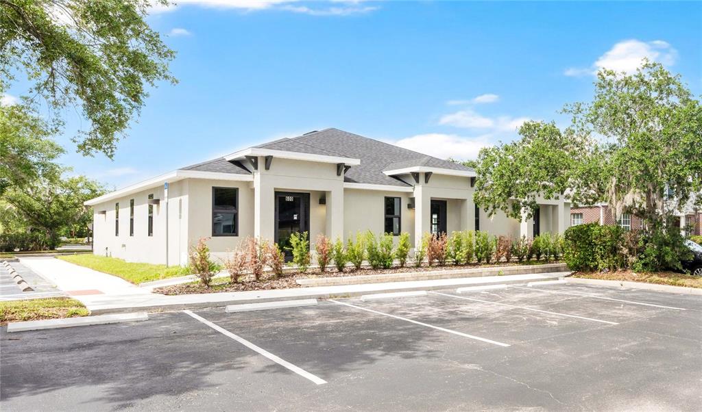 A single-story commercial building with a parking lot and landscaping in front — 600 LEXINGTON GREEN LANE, SANFORD, FL