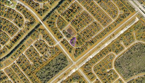 An aerial map view shows a highlighted vacant lot within a residential neighborhood — MANSFIELD CIRCLE, NORTH PORT, FL