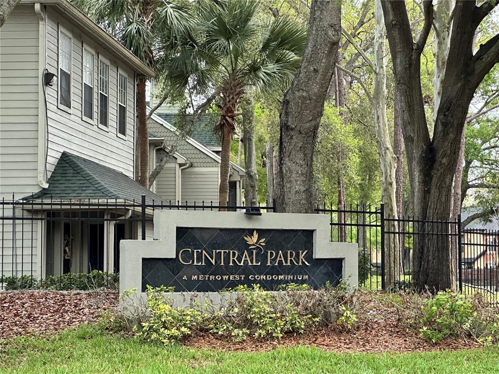 A sign for Central Park at Metrowest Condominium stands in front of a multi-story building — 6004 WESTGATE DRIVE UNIT 301, ORLANDO, FL