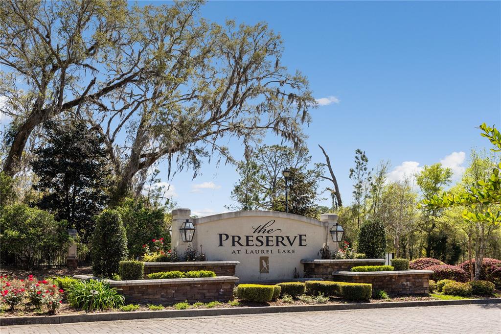A stone monument sign for The Preserve at Laurel Lake sits in a landscaped area — 133 SW BELLFLOWER DRIVE, LAKE CITY, FL