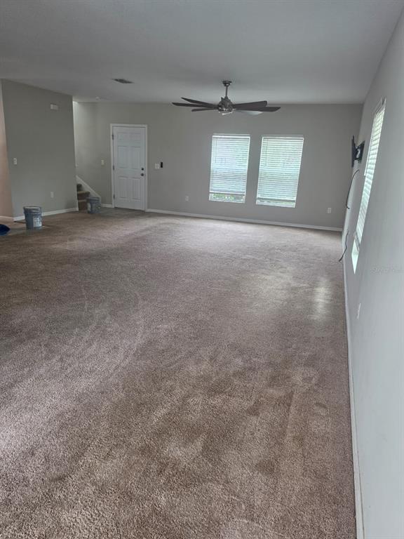 A walk-in pantry with white wire shelving and light-colored wood-look flooring — 13013 UPWARD PLACE, RIVERVIEW, FL