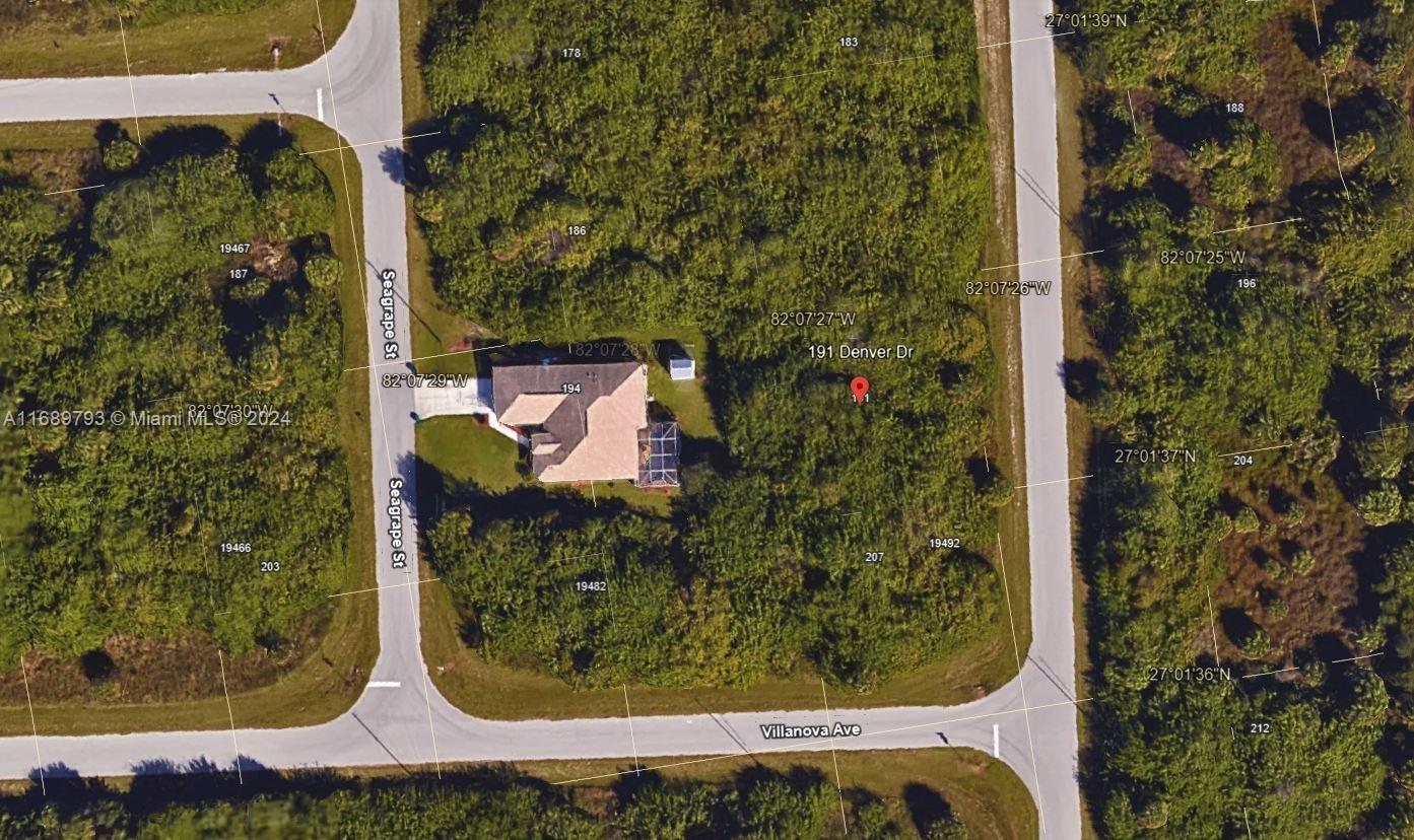 This is an aerial map showing a residential property with a house and surrounding vegetation — PORT CHARLOTTE, FL
