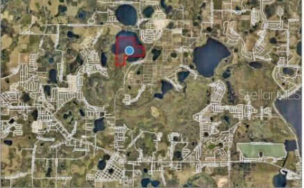 An aerial map shows a highlighted property parcel situated next to a lake — SR-19, GROVELAND, FL