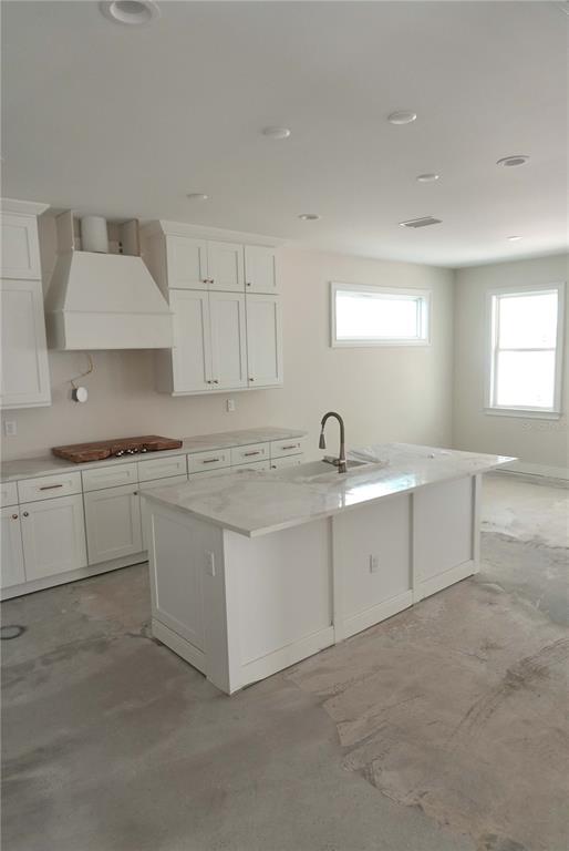 A two-story house with white siding, a paved driveway, and a covered front entryway — 3905 W TACON STREET, TAMPA, FL