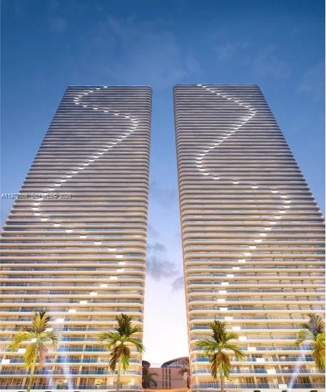 This is a rendering of two identical modern high-rise residential towers with illuminated balconies — 700 NE 24 ST # 1406, Miami FL 33137, MIAMI, FL