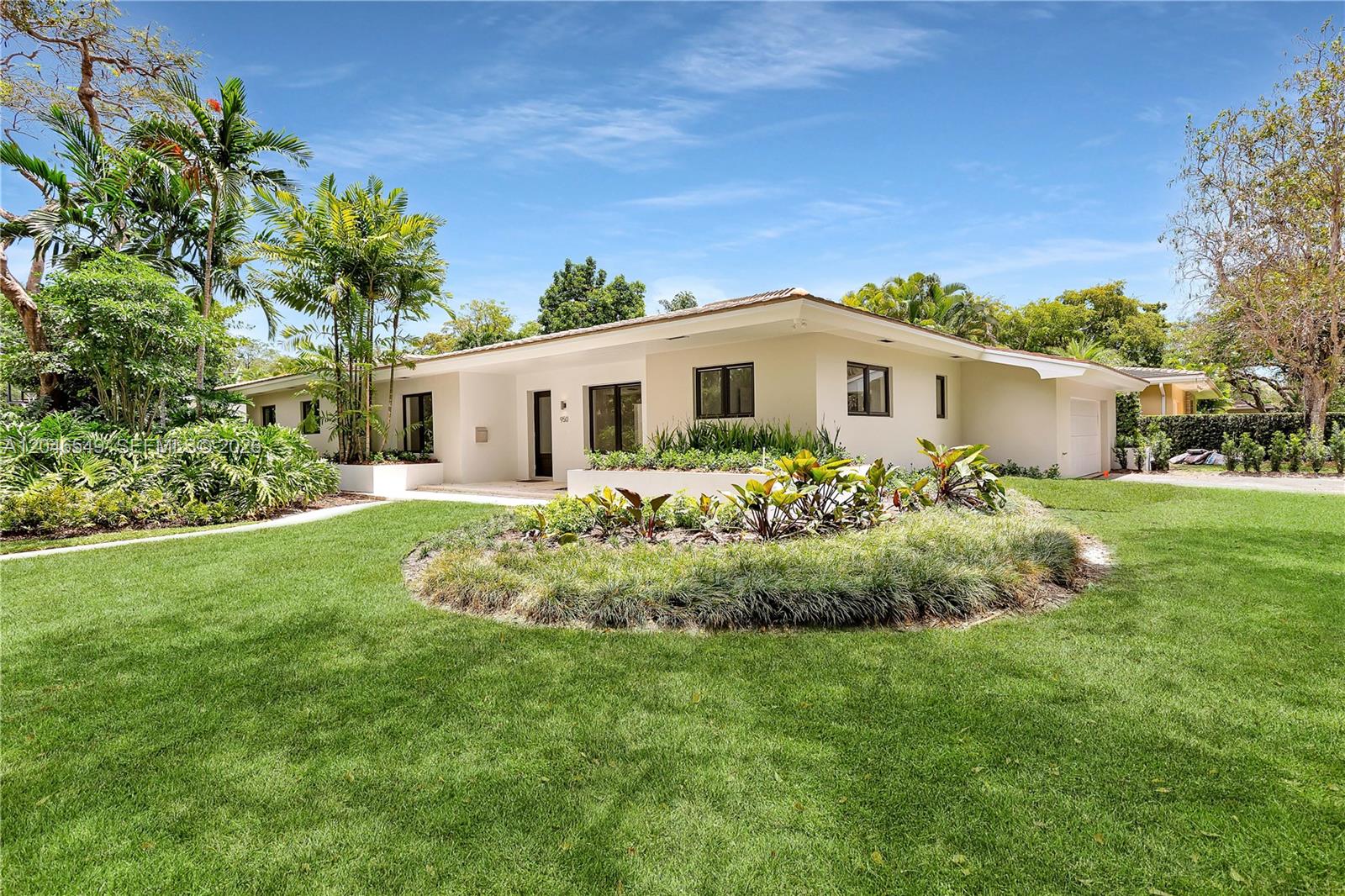 A single-story house with a white exterior, flat roof, and landscaped front yard — 950 Bayamo Ave, Coral Gables FL 33146, CORAL GABLES, FL