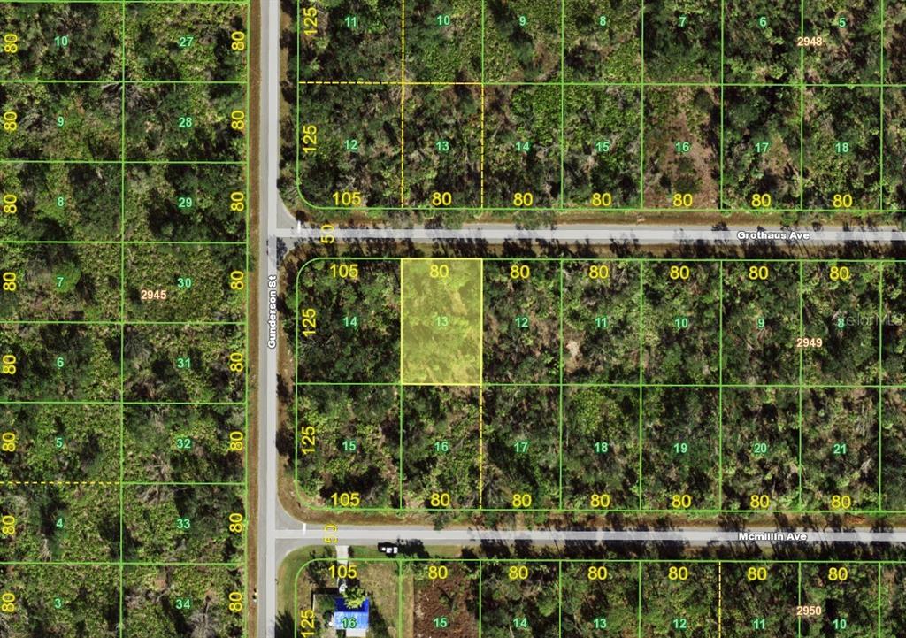 This is an aerial map showing a highlighted rectangular land parcel among surrounding wooded lots — 14433 GROTHAUS AVENUE, PORT CHARLOTTE, FL
