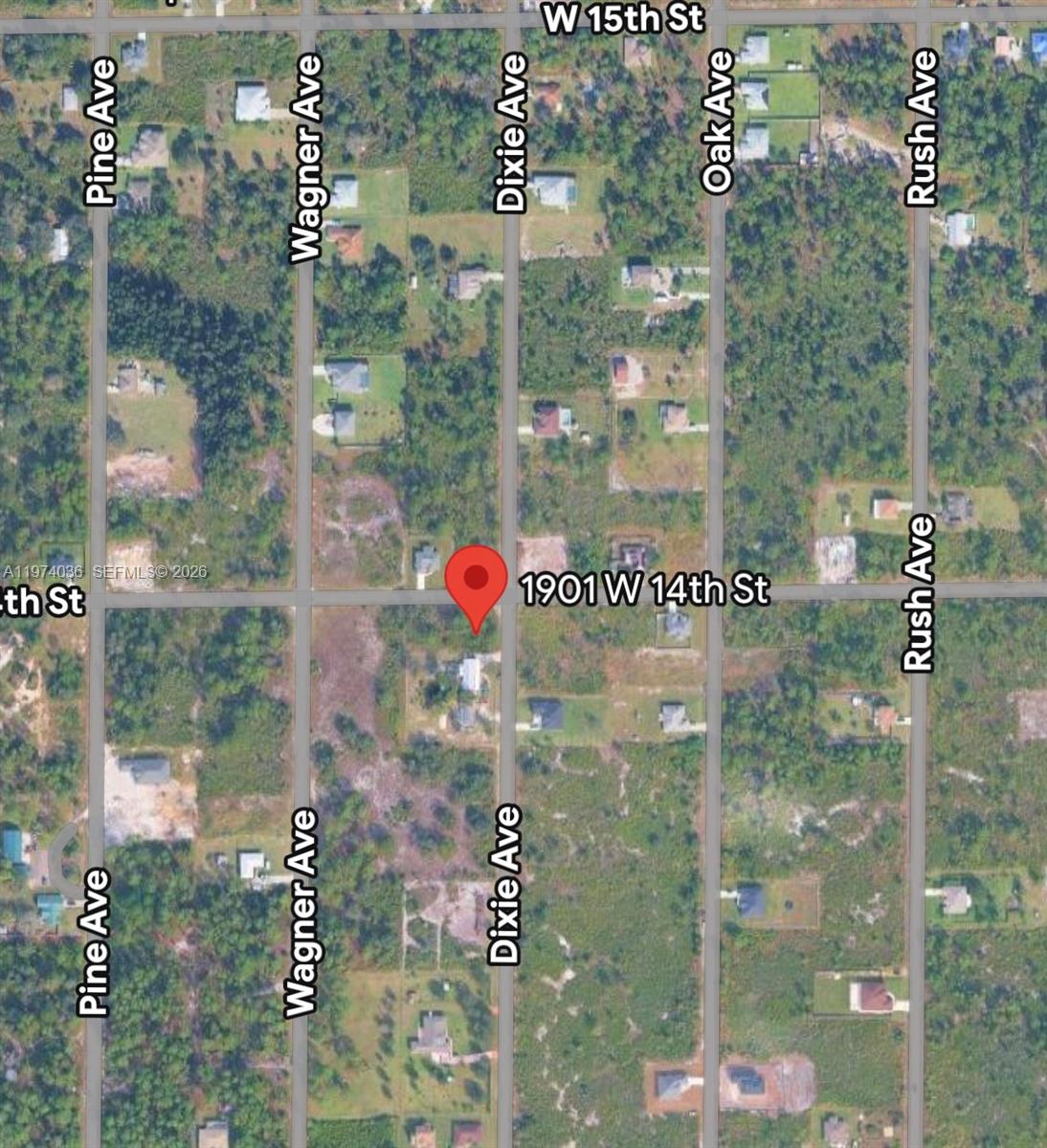 This is a satellite map view showing a residential property lot at a street intersection — 1901 W 14th St, Lehigh Acres FL 33972, LEHIGH ACRES, FL