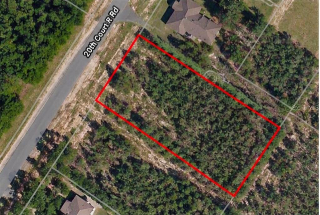 An aerial view shows a rectangular, wooded vacant lot outlined in red along a road — TBD SW 20TH COURT ROAD, OCALA, FL