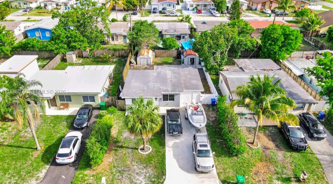 An aerial view shows three single-story houses with driveways, parked vehicles, and a boat — 6336 SW 22nd St, Miramar FL 33023, MIRAMAR, FL
