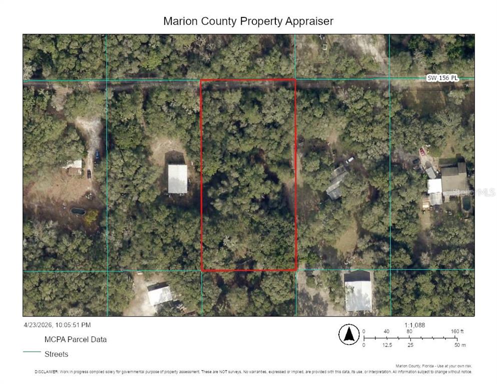 This is an aerial map showing a rectangular parcel of land outlined in red — SW 156TH PLACE, DUNNELLON, FL