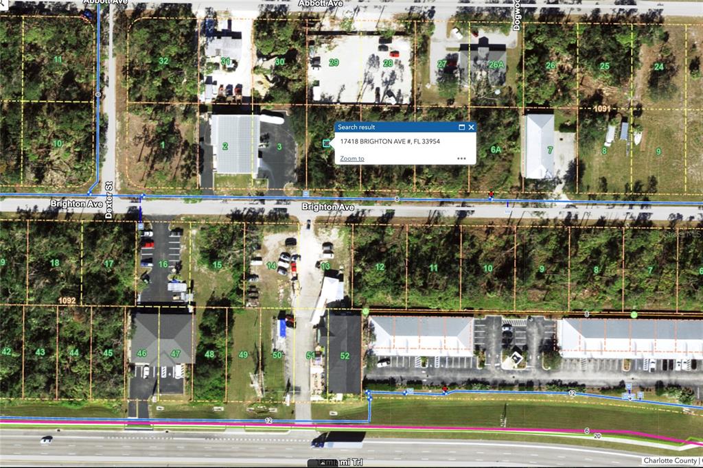 This is an aerial map showing land parcels, roads, and buildings in a residential area — 17418 BRIGHTON AVENUE, PORT CHARLOTTE, FL