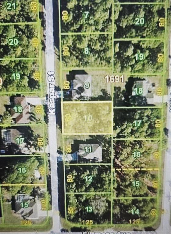 This is a map showing a vacant residential lot highlighted in yellow among surrounding properties — 5400 KASPAR STREET, PORT CHARLOTTE, FL