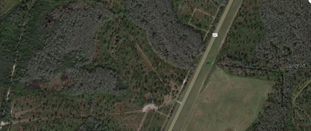 This aerial map shows a rural plot of land adjacent to a highway — S KENANSVILLE ROAD, OKEECHOBEE, FL