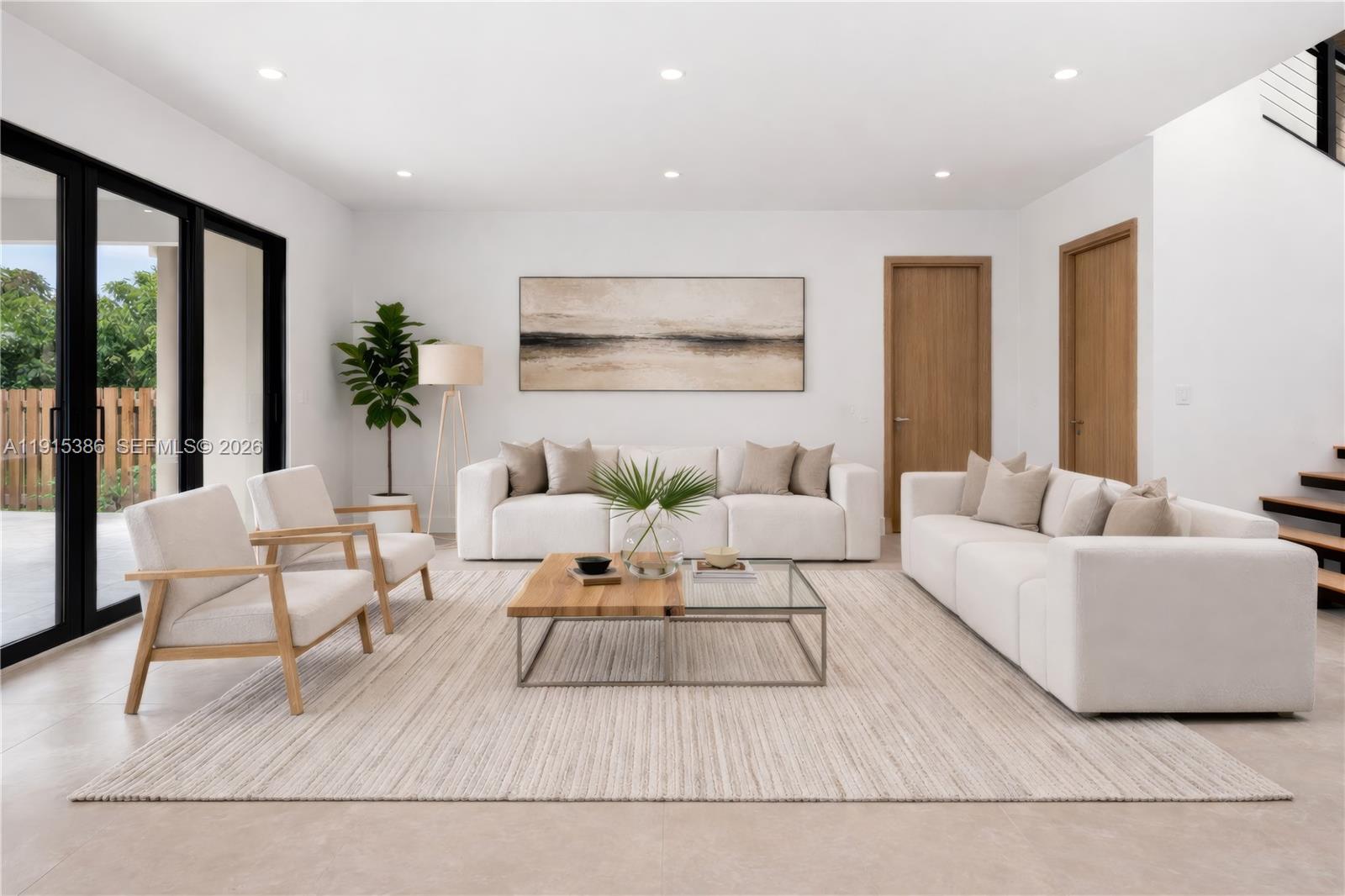 A modern living room features two white sofas, two armchairs, and a central coffee table — 1366 SW 15th St, Miami FL 33145, MIAMI, FL