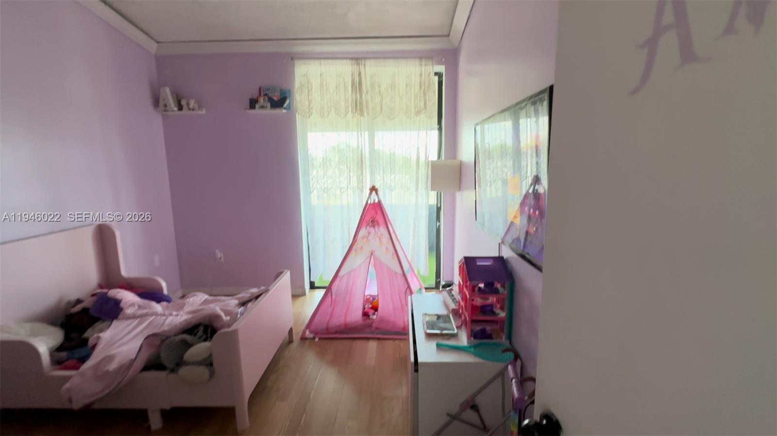 A child's bedroom features purple walls, a pink bed, and a pink play tent — 16220 NW 2nd Ave # 513, Miami FL 33169, MIAMI, FL