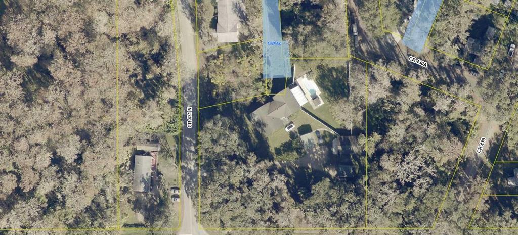 This aerial map shows a residential property with a house, pool, and canal access — 3057 CR 431N, LAKE PANASOFFKEE, FL