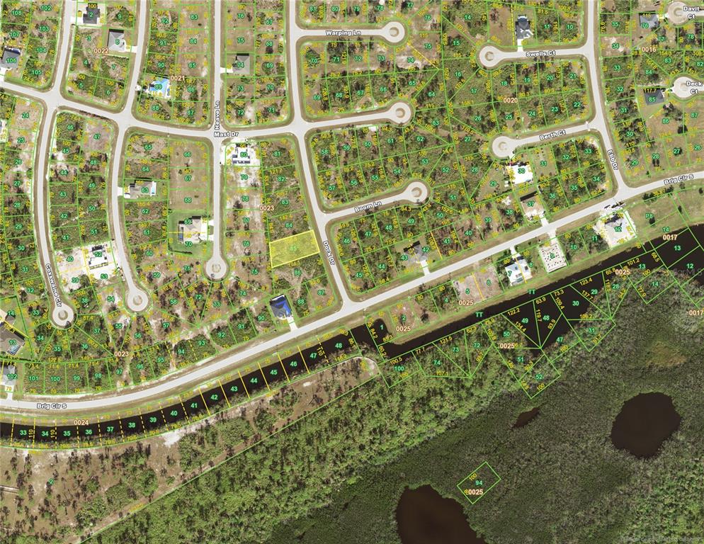 This is an aerial map showing residential lots, streets, and wooded areas in a neighborhood — 8 DOCK DRIVE, PLACIDA, FL