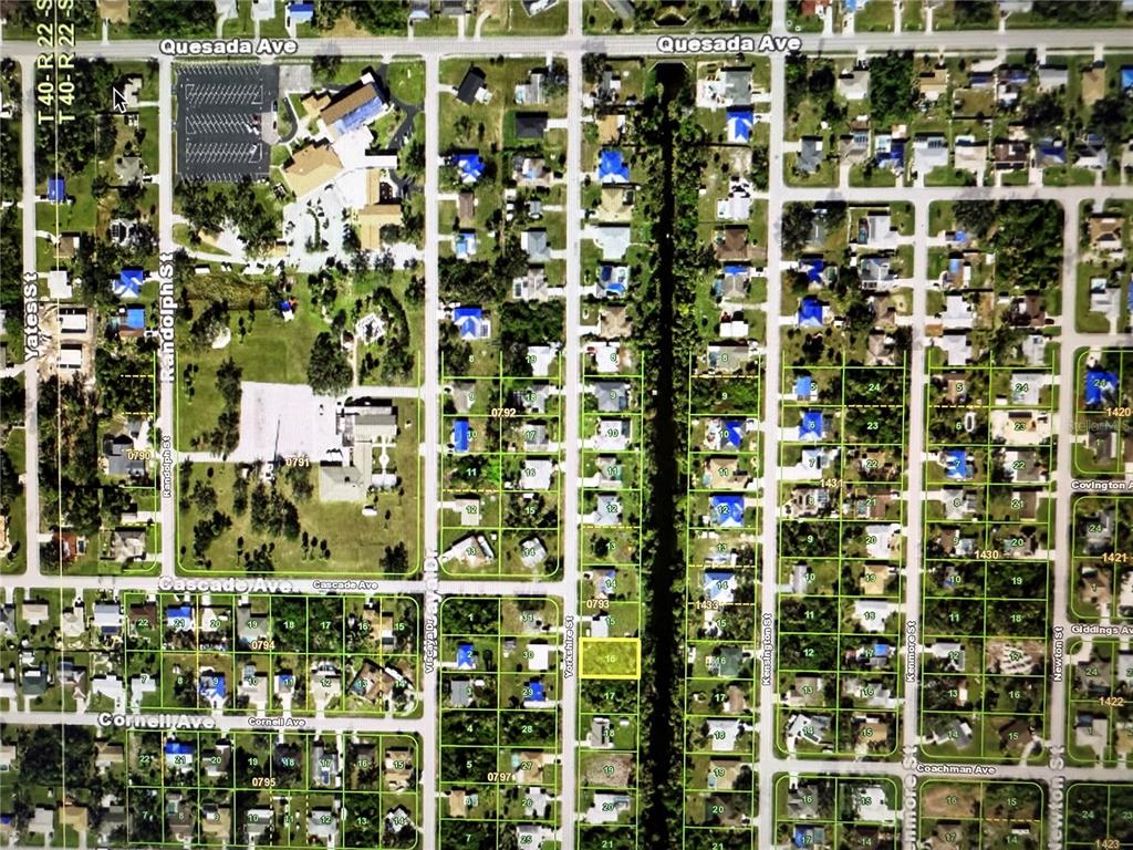 This is an aerial map showing residential lots, streets, and a canal in a neighborhood — 1402 YORKSHIRE STREET, PORT CHARLOTTE, FL