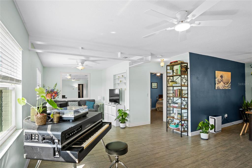 An aerial view of a single-story house with a gray roof and white exterior walls — 7924 PLUNKETT AVENUE, ORLANDO, FL