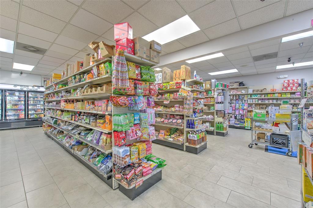 A retail store interior features multiple aisles of shelves stocked with various food products — 5537 SHELDON ROAD UNIT V, TAMPA, FL
