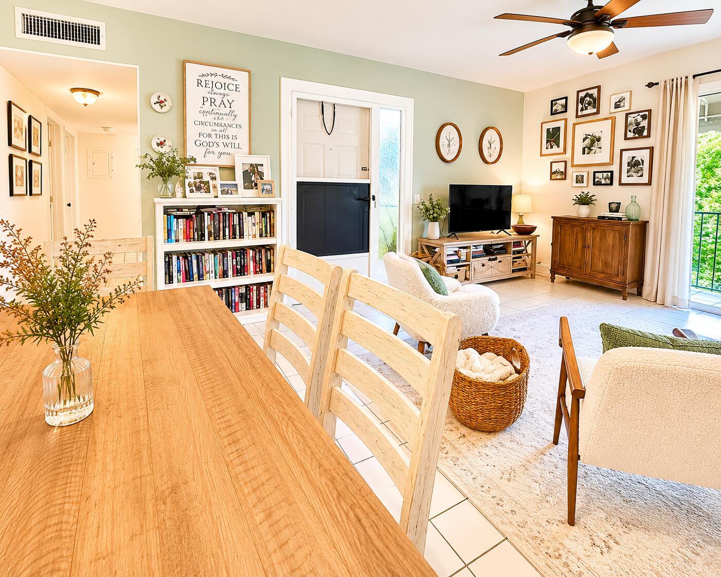 A living room and dining area feature light wood furniture, a green accent wall, and tile flooring — 179 Waterside Drive # 179, Hypoluxo FL 33462, HYPOLUXO, FL