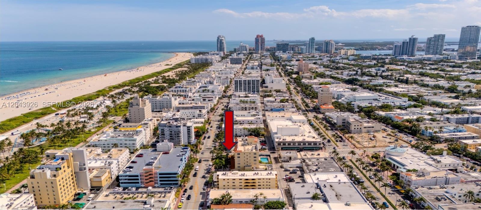An aerial view shows a multi-story building marked with a red arrow in Miami — 1300 Collins NE St, Miami FL 33139, MIAMI, FL