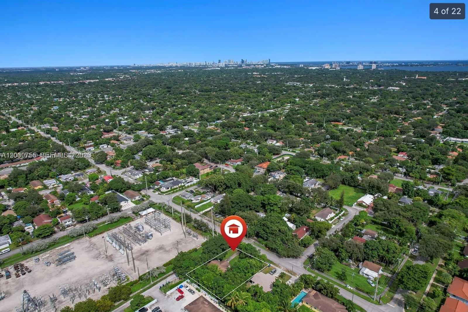 An aerial view shows a house on a lot adjacent to an electrical substation — 9156 NW 5th Ave, Miami FL 33150, MIAMI, FL