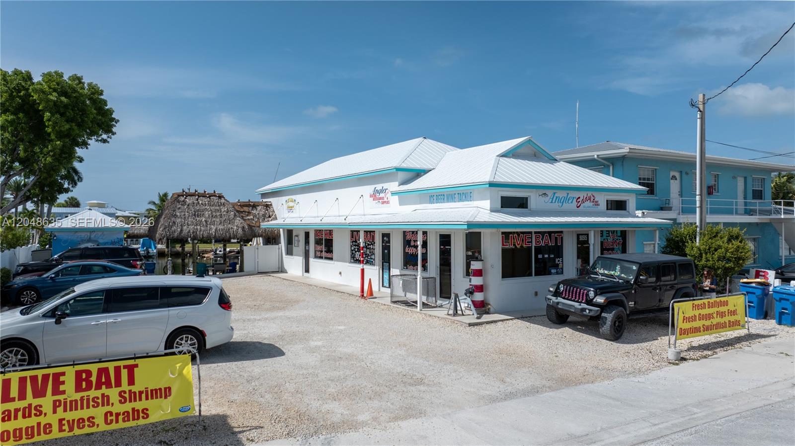 A white commercial building with a metal roof and a gravel parking lot — 90515 Old Hwy, Tavernier FL 33070, TAVERNIER, FL