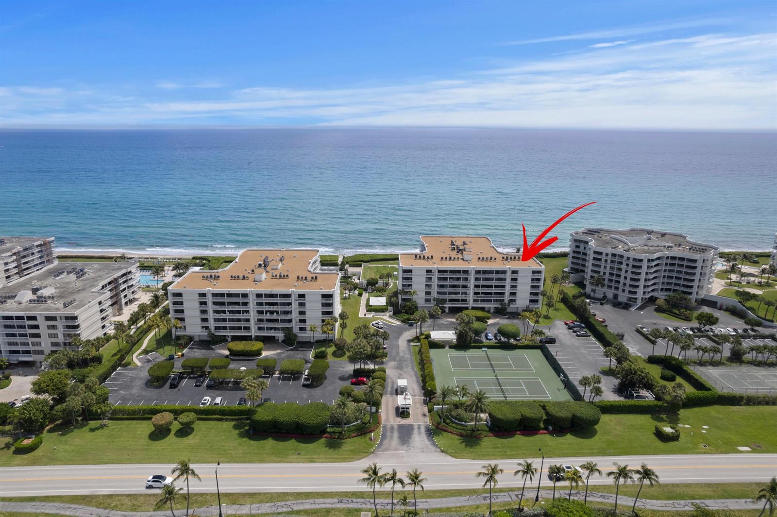An aerial view shows three beachfront condominium buildings with tennis courts and parking lots — 3300 S Ocean Boulevard # 504s, Palm Beach FL 33480, PALM BEACH, FL