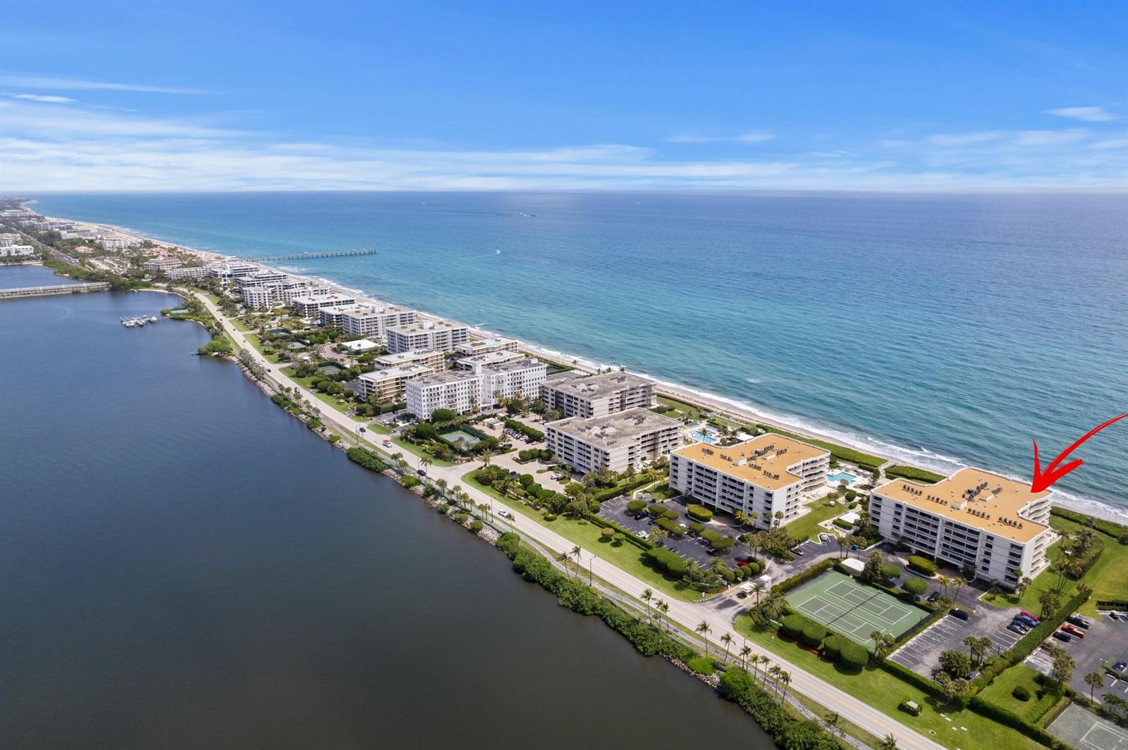 An aerial view shows a coastal condominium complex with a red arrow pointing to a unit — 3300 S Ocean Boulevard # 504s, Palm Beach FL 33480, PALM BEACH, FL