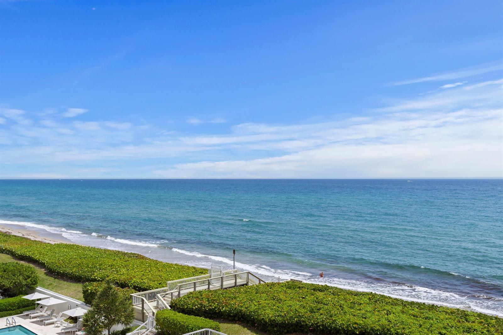 An elevated view of a beach with a wooden walkway leading to the sand — 3300 S Ocean Boulevard # 504s, Palm Beach FL 33480, PALM BEACH, FL
