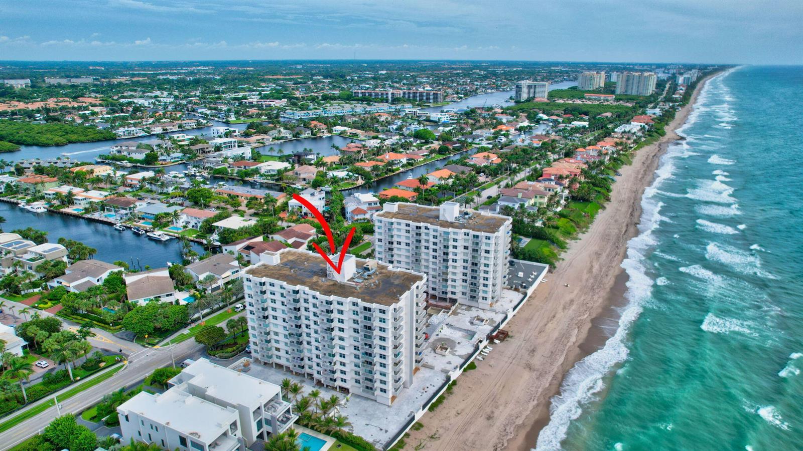 An aerial view of a multi-story beachfront condominium building located along the coast — 4511 S Ocean Boulevard # 401, Highland Beach FL 33487, HIGHLAND BEACH, FL