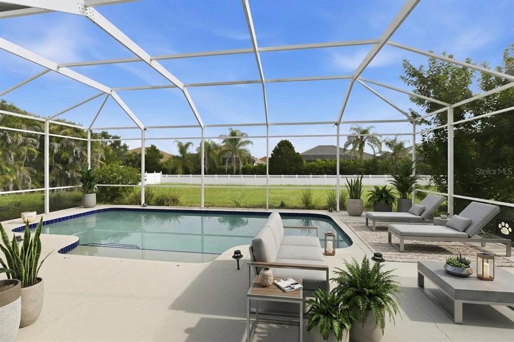 A screened-in pool patio features a swimming pool, lounge chairs, and outdoor seating furniture — 16323 UPPER MANATEE RIVER ROAD, BRADENTON, FL