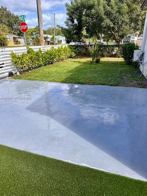A paved driveway leads to a grassy yard with a hedge and a stop sign — 5180 NW 14th Ave # B, Miami FL 33142, MIAMI, FL