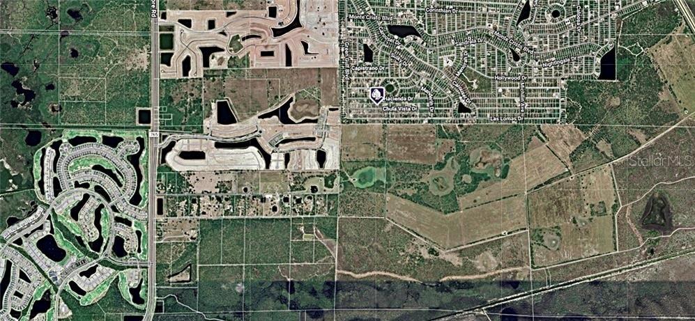 This is an aerial map showing residential neighborhoods, undeveloped land, and road networks — 27102 CHULA VISTA DRIVE, PUNTA GORDA, FL