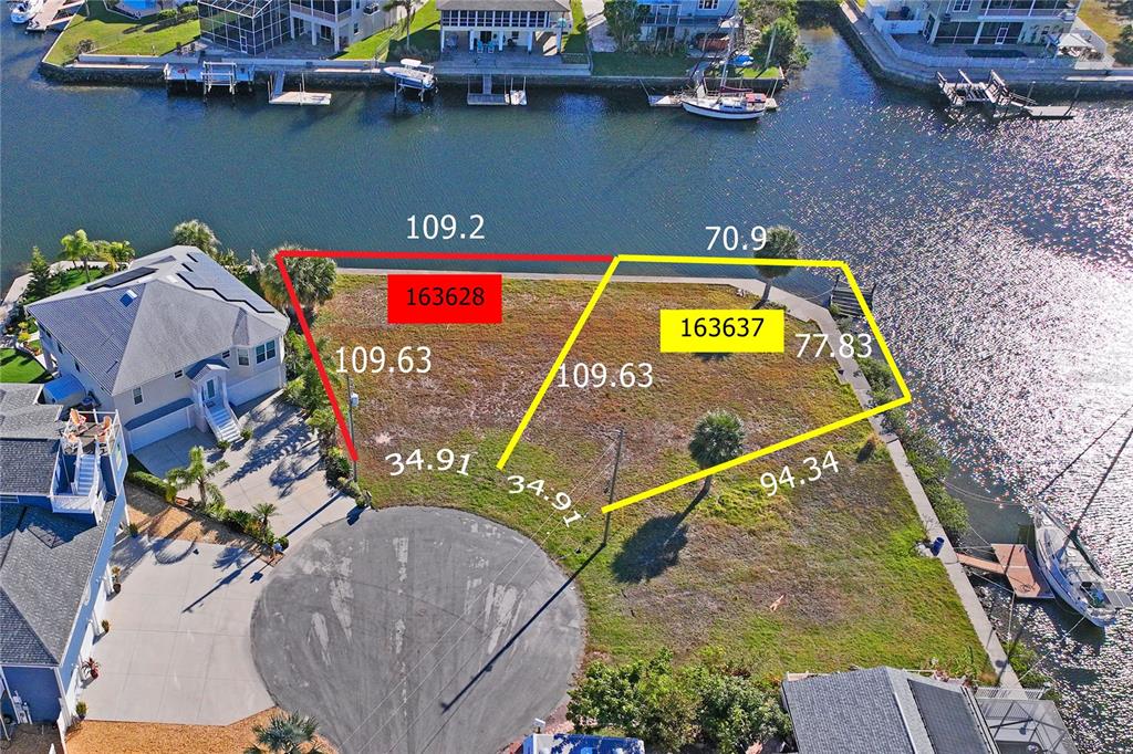 An aerial view shows two adjacent waterfront vacant lots marked with property lines and dimensions — Lot 8 6TH ISLE, HERNANDO BEACH, FL