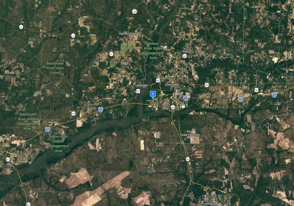 This is a satellite map showing Crestview, Florida, and the surrounding forested areas — 921 MARACEL LOOP, CRESTVIEW, FL
