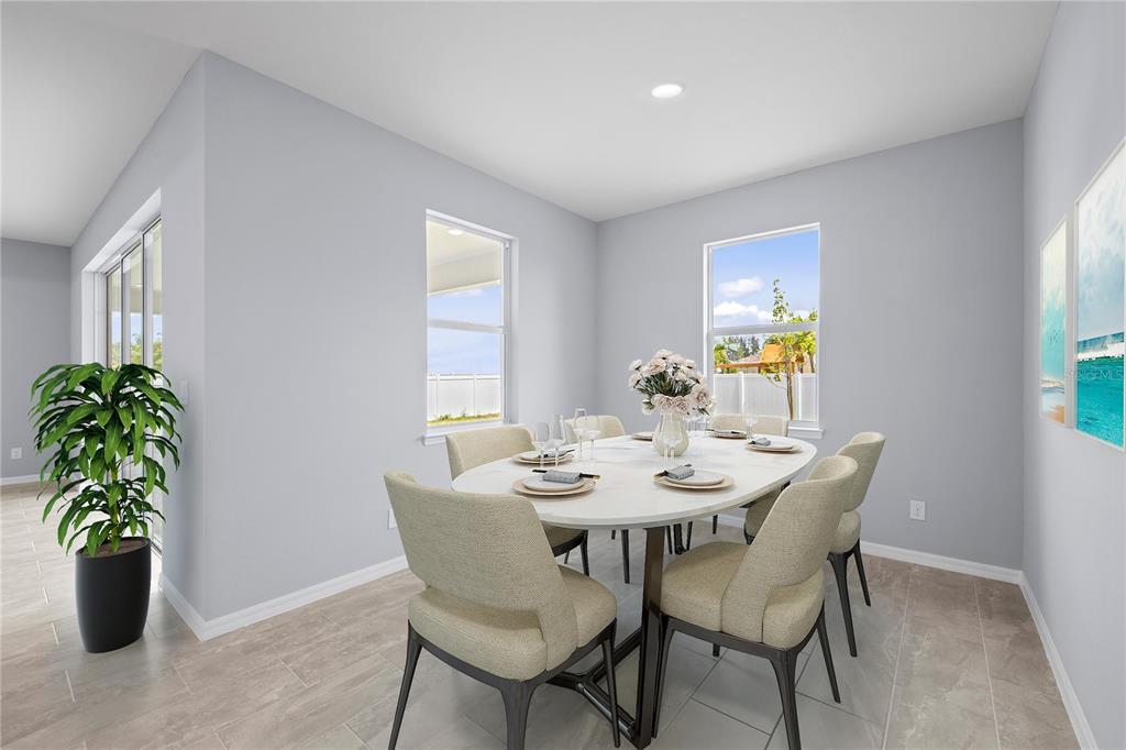 A dining room features a white oval table, six upholstered chairs, and light tile flooring — 14148 SLICHTER AVENUE, PORT CHARLOTTE, FL