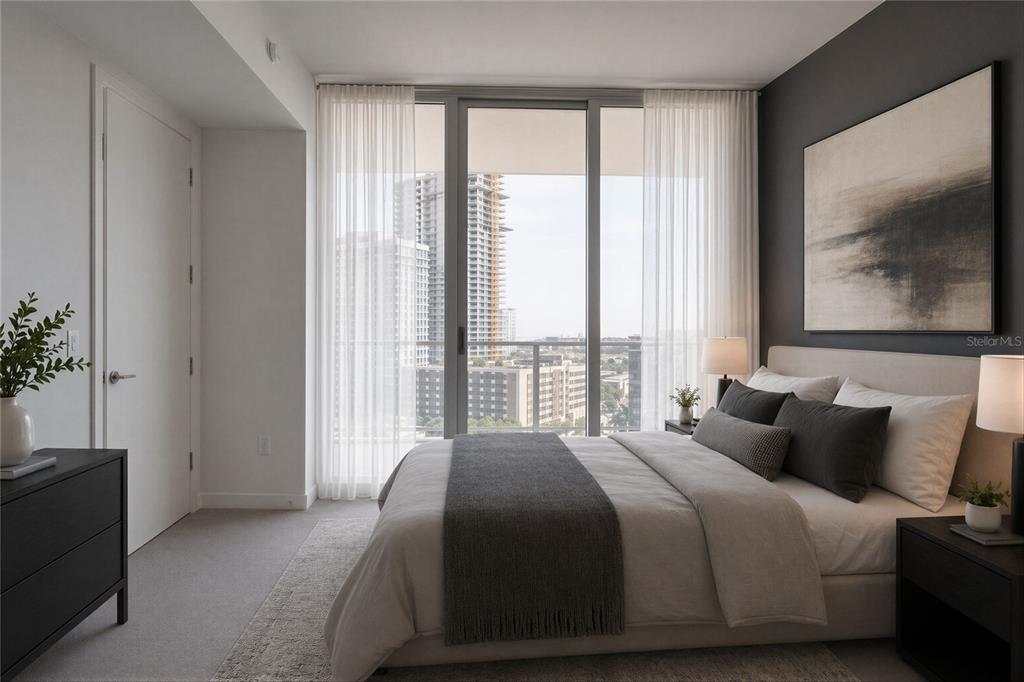 A modern bedroom features a bed, dark accent wall, and floor-to-ceiling windows with city views — 400 CENTRAL AVENUE UNIT 1003, ST PETERSBURG, FL