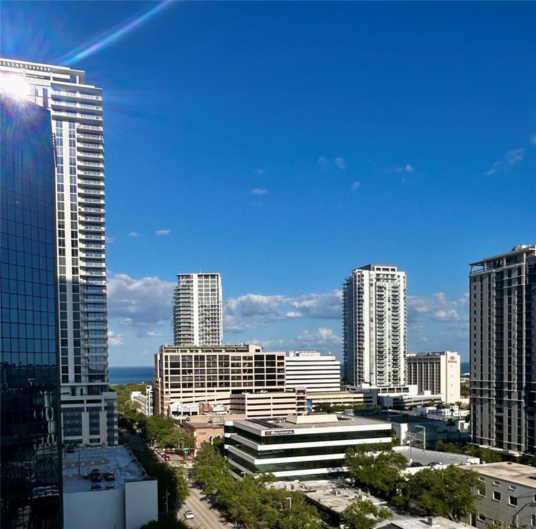 An elevated view of a city skyline featuring several tall residential and commercial buildings — 400 CENTRAL AVENUE UNIT 1003, ST PETERSBURG, FL