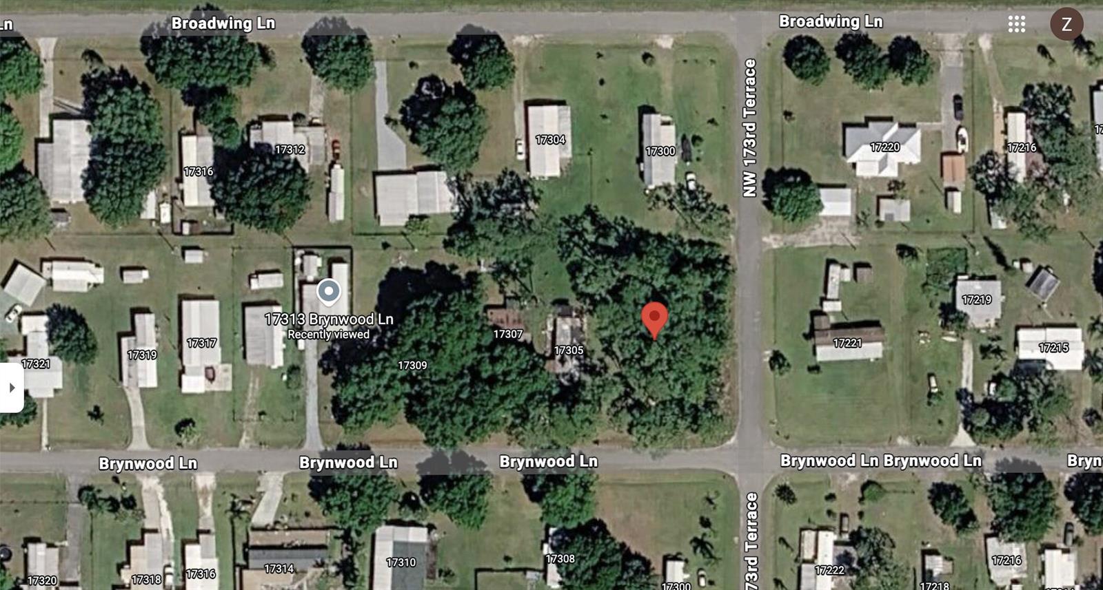 This is a satellite map view of a residential neighborhood with several houses and trees — 17301 Brynwood Lane, Okeechobee FL 34974, OKEECHOBEE, FL
