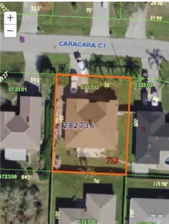 This aerial map shows a residential property lot outlined in orange on Caracara Court — 704 CARACARA COURT, KISSIMMEE, FL