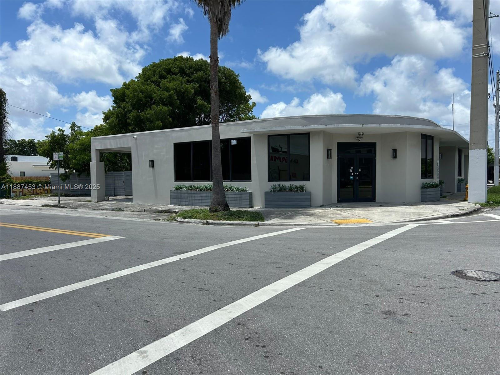 A single-story commercial building with a curved facade sits on a corner lot — 4200 NW 2nd Ave, Miami FL 33127, MIAMI, FL