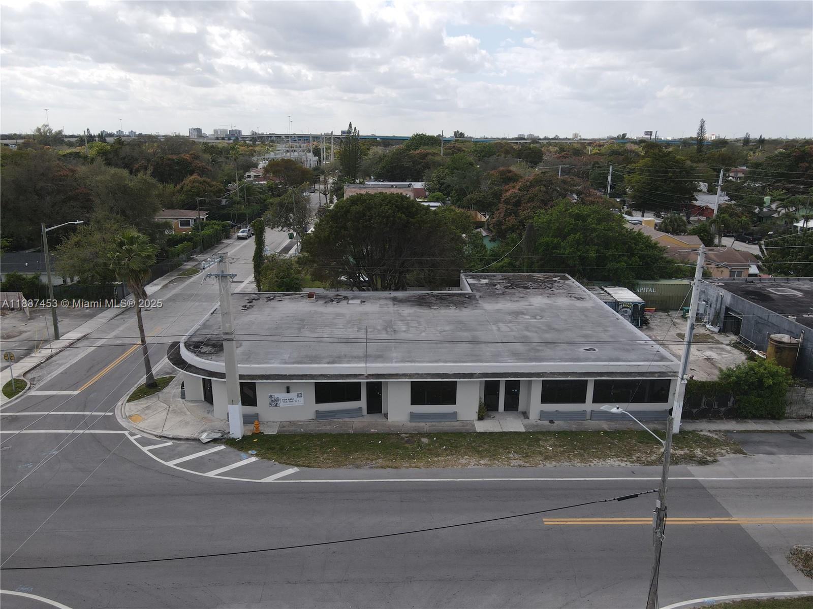 An aerial view shows a single-story commercial building with a flat roof on a corner lot — 4200 NW 2nd Ave, Miami FL 33127, MIAMI, FL
