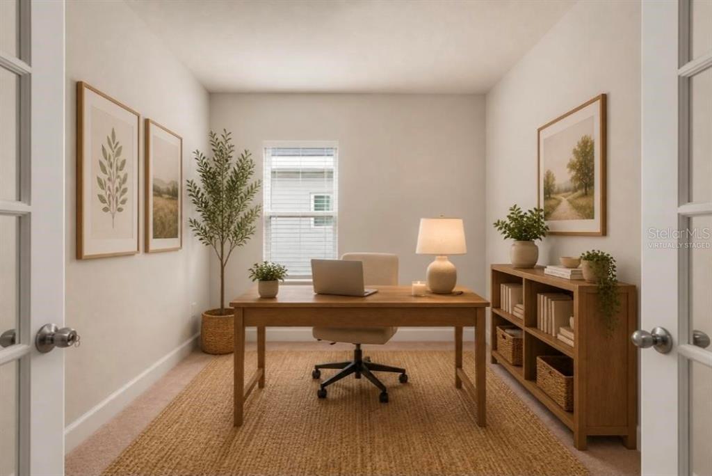 A home office features a wooden desk, a chair, a bookshelf, and a window — 357 SIESTA VISTA COURT, DAVENPORT, FL